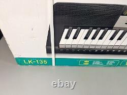 Casio LK-135 61 Lighted Key Keyboard 120 Tones/70 Rhythms/Music Modes with Stand