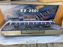 New Yamaha EZ-250i PortaTone Keyboard Piano BRAND NEW IN BOX W HOLDER N BOOKLETS